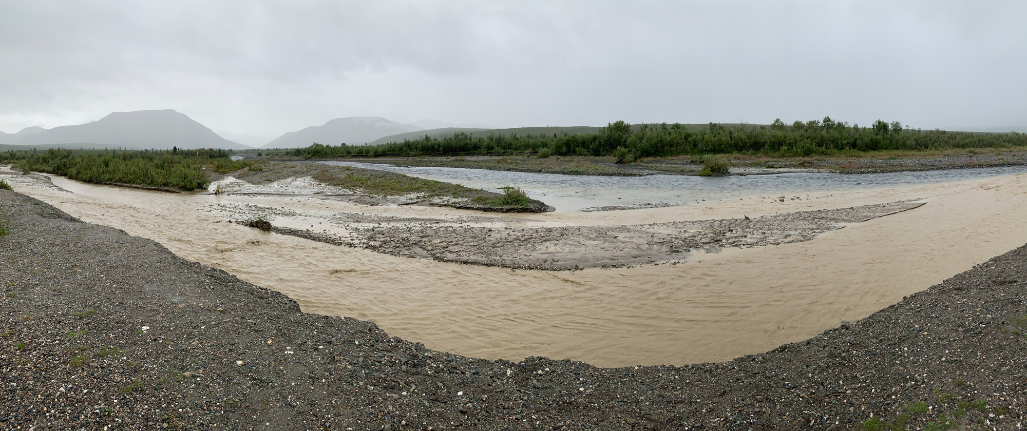 Photograph showing the confluence of two streams in Alaska.